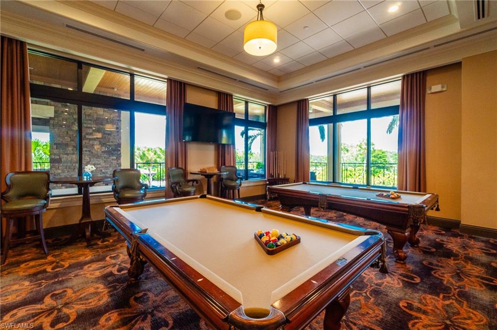 9590 Trevi Court, Unit 5317 Naples, FL 34113 - Photo 27 of 38 a room with furniture pool table and windows
