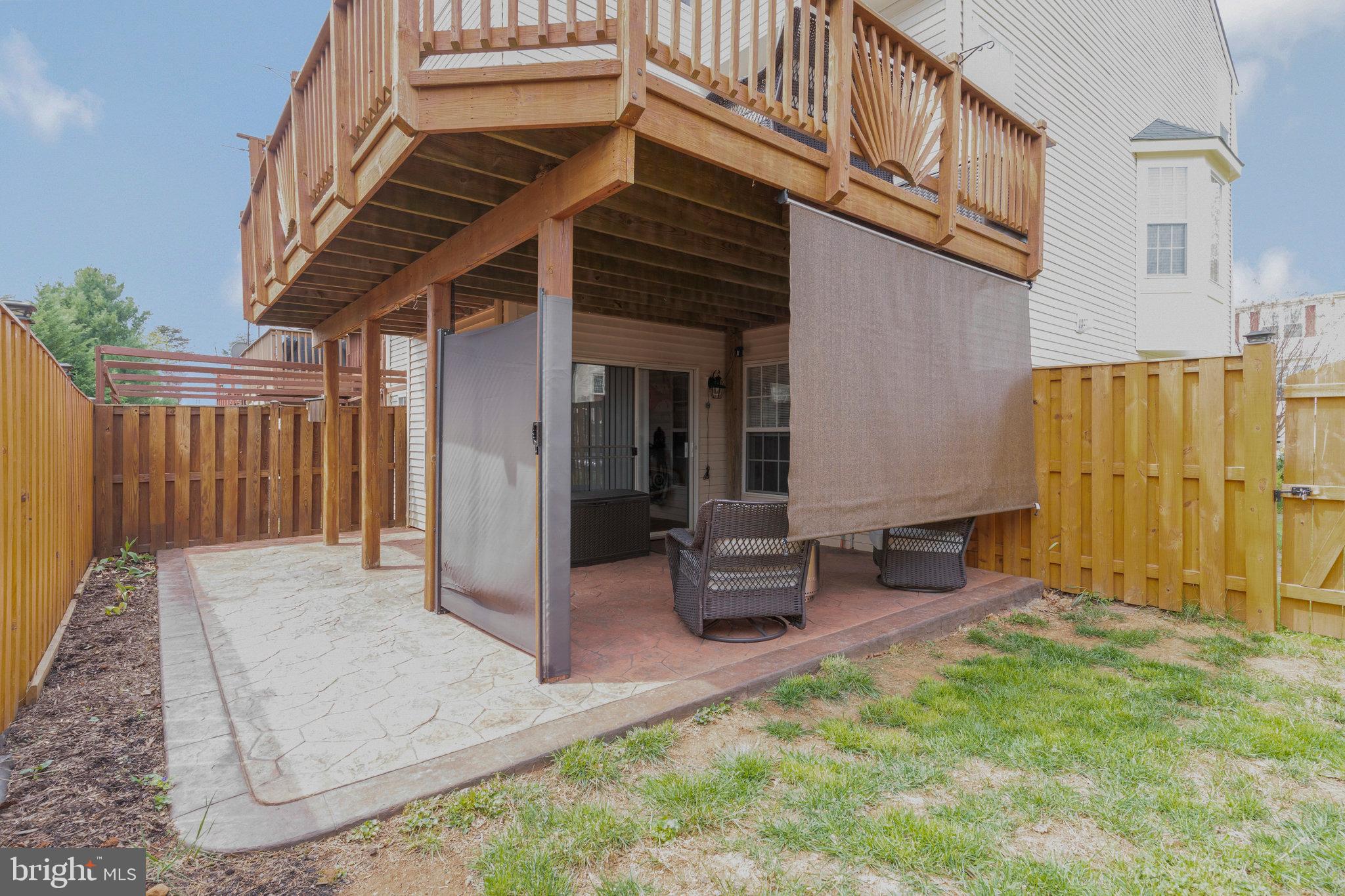 8110 Cerromar Way Gainesville, VA 20155 - Photo 43 of 51 Lower Level Patio w/ Privacy Screens