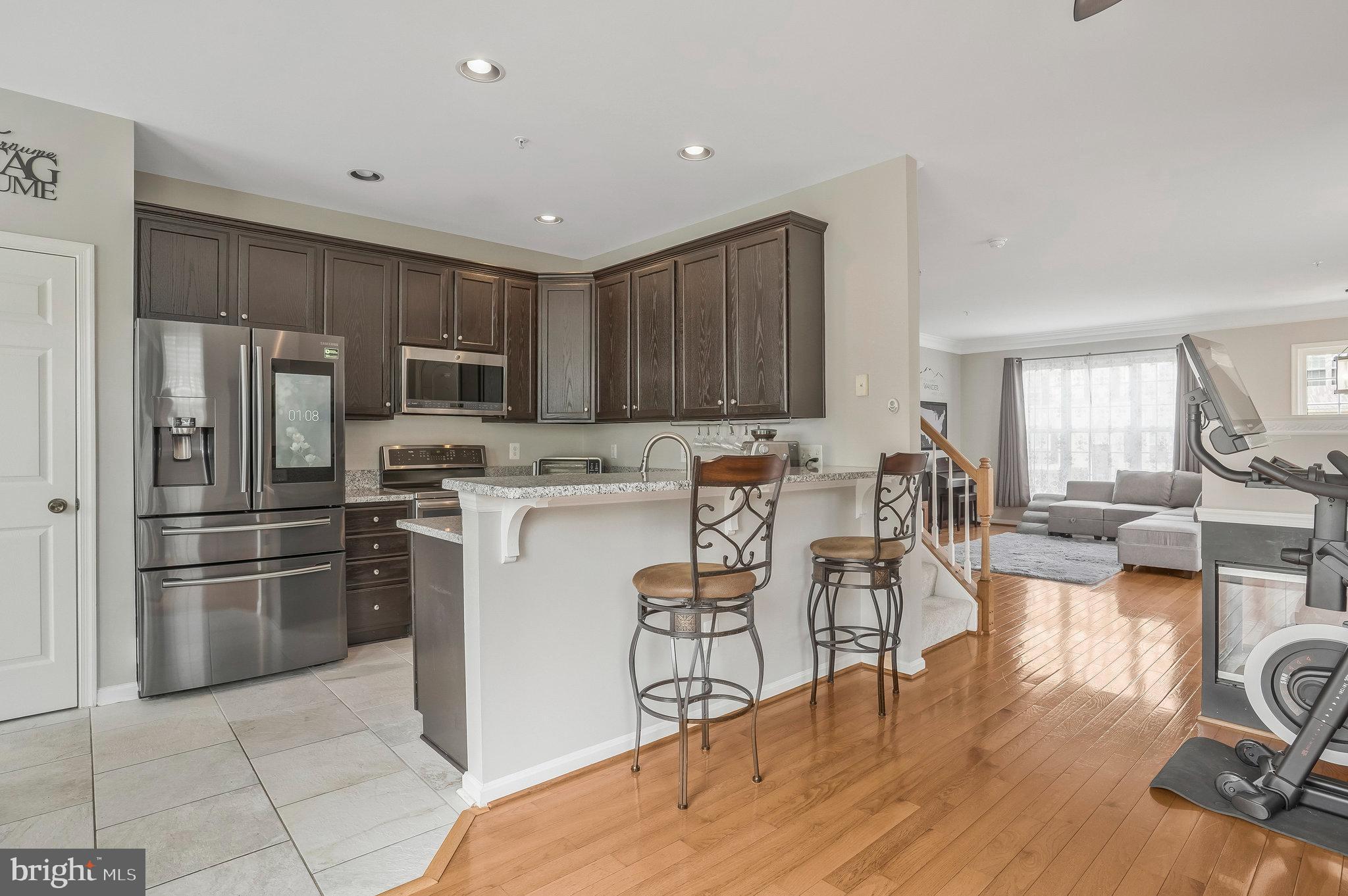 8110 Cerromar Way Gainesville, VA 20155 - Photo 10 of 51 Gourmet Kitchen w/ Two Level Granite Countertops