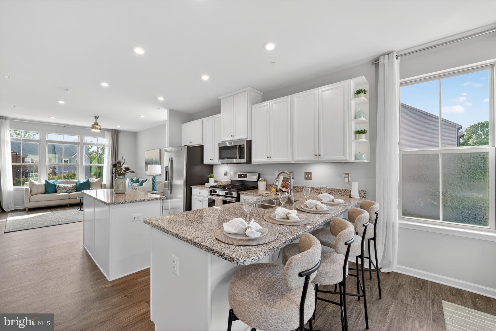 3111 Potters Hill Road Hanover, MD 21076 - Photo 12 of 40 a view of a dining room with furniture a kitchen and chandelier