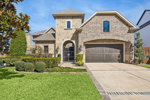 a living room with furniture and next to a large window