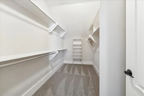 a view of a house with swimming pool and sitting area