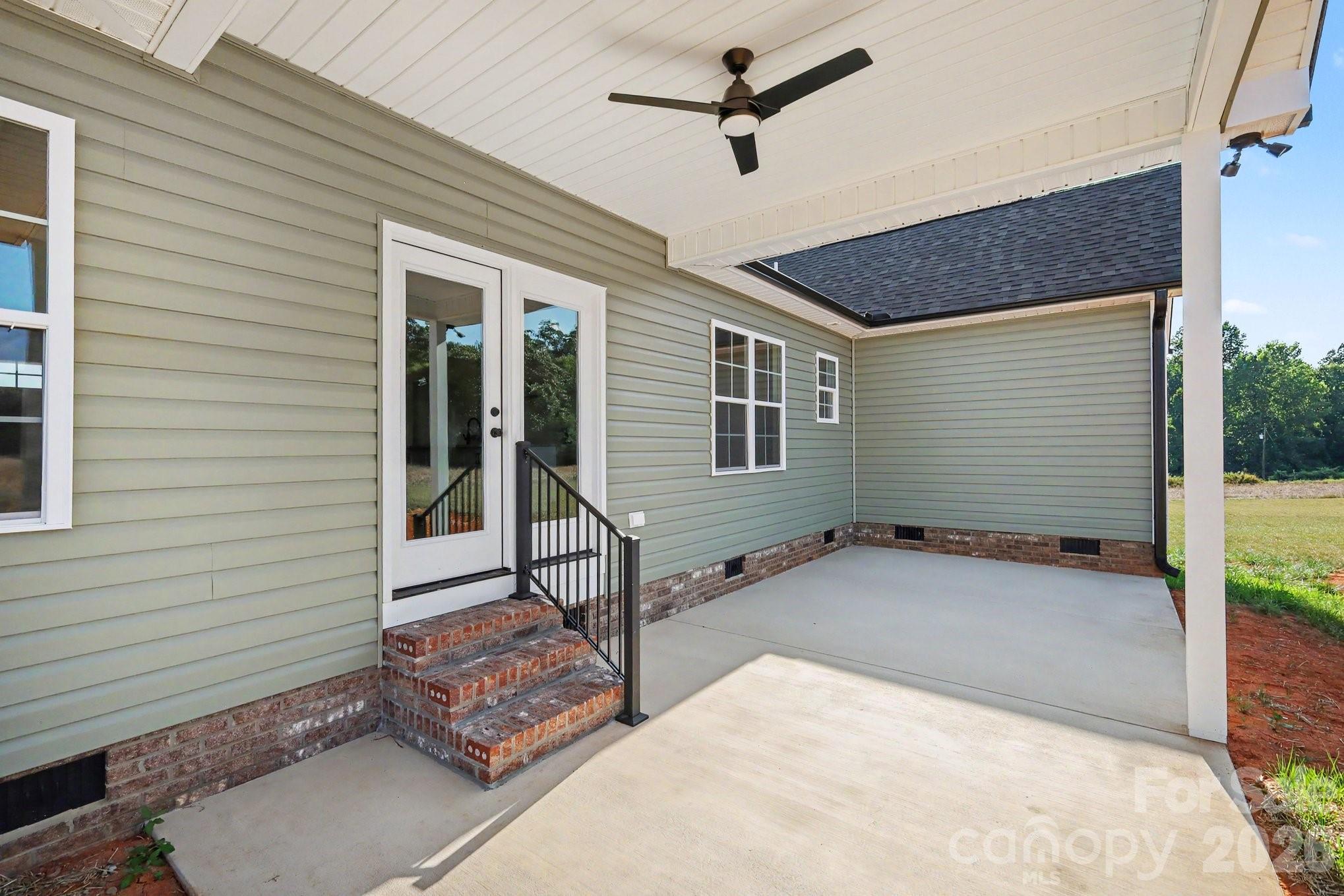 190 Goodnight Road Salisbury, NC 28147 - Photo 31 of 35 a backyard of a house with table and outdoor seating