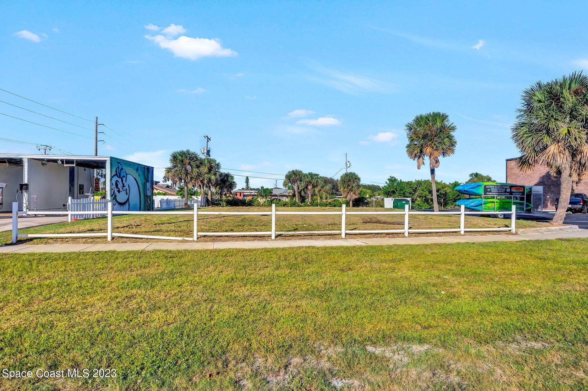 310 North Atlantic Avenue Cocoa Beach, FL 32931 - Photo 3 of 11 a view of a swimming pool with an outdoor space and seating area