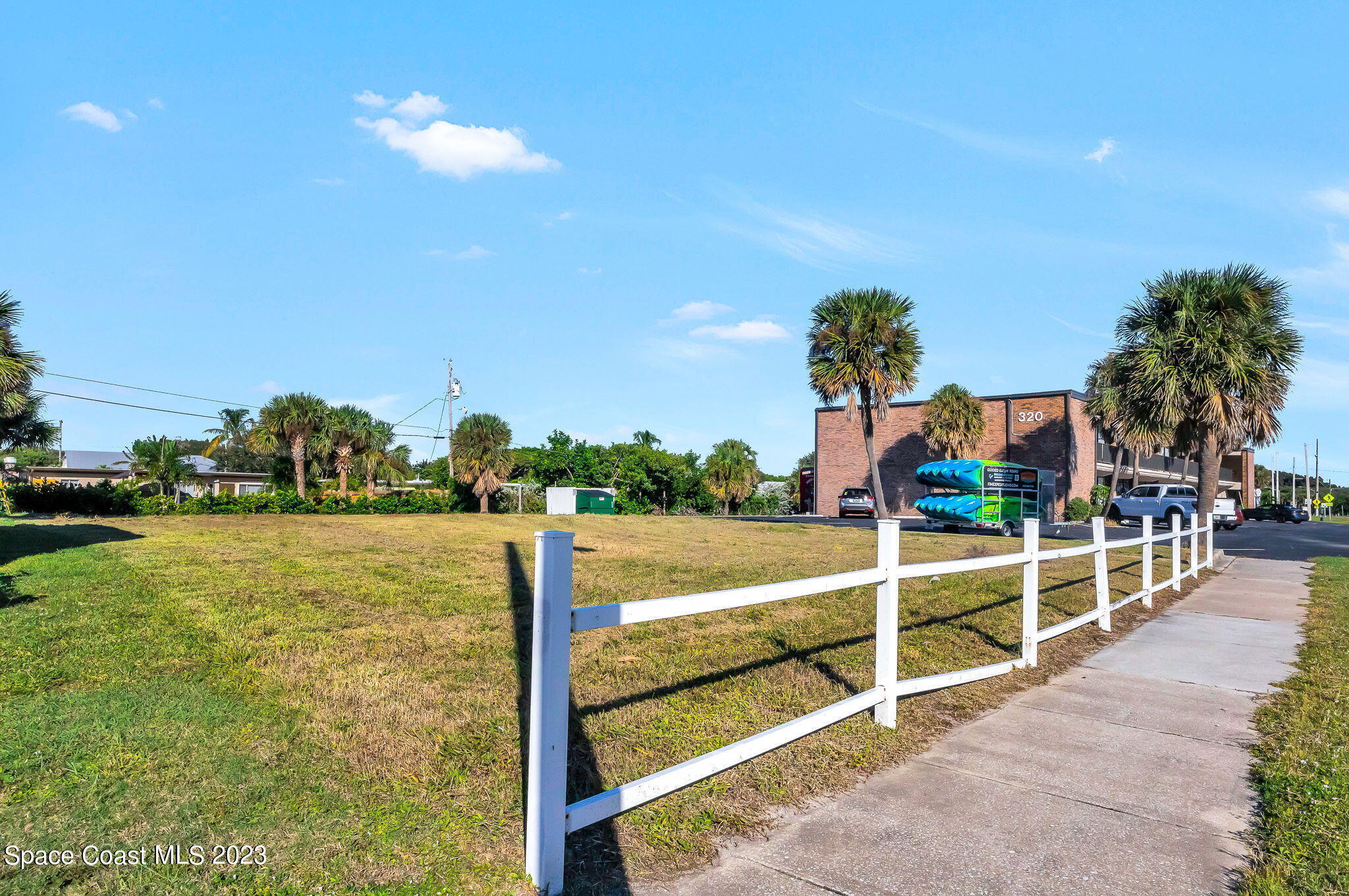 310 North Atlantic Avenue Cocoa Beach, FL 32931 - Photo 7 of 11 a view of a swimming pool with a lounge chairs