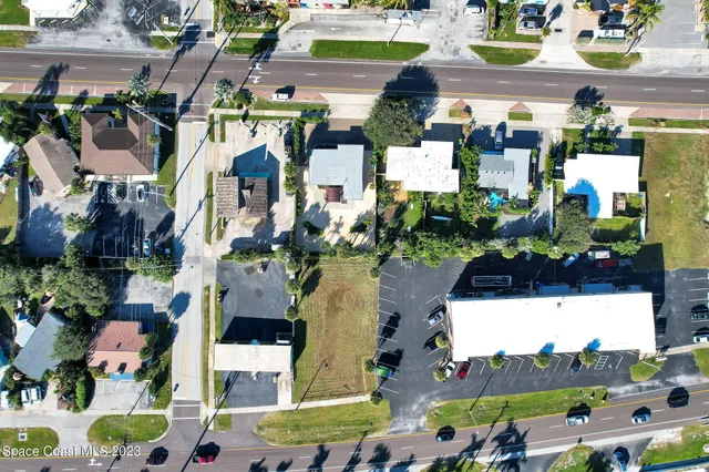 a view of multiple houses with outdoor space