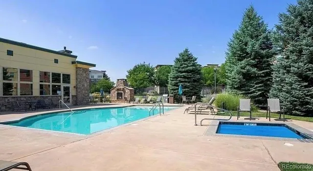 a view of a swimming pool with a patio