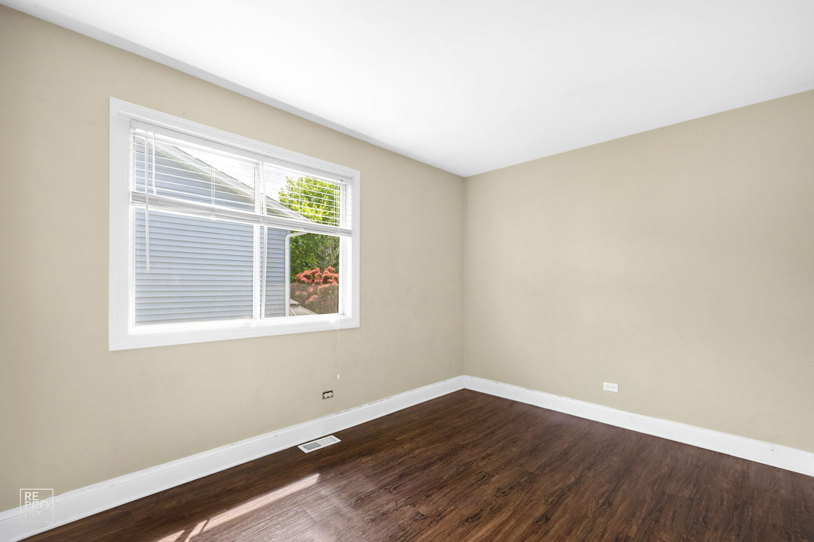 48 Pheasant Road Matteson, IL 60443 - Photo 17 of 23 a view of an empty room with wooden floor and a window