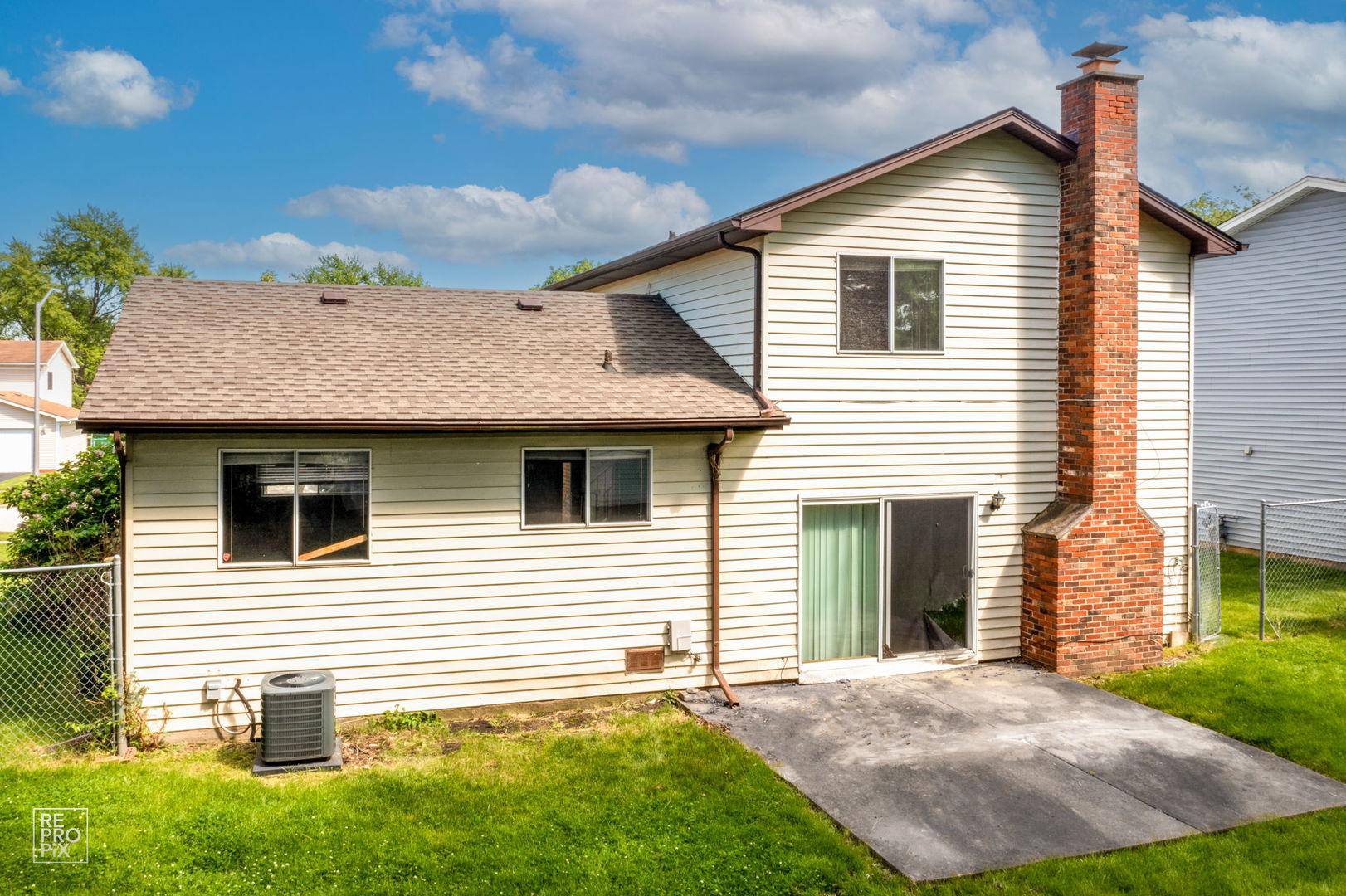 48 Pheasant Road Matteson, IL 60443 - Photo 6 of 23 a view of a white house next to a yard and trees