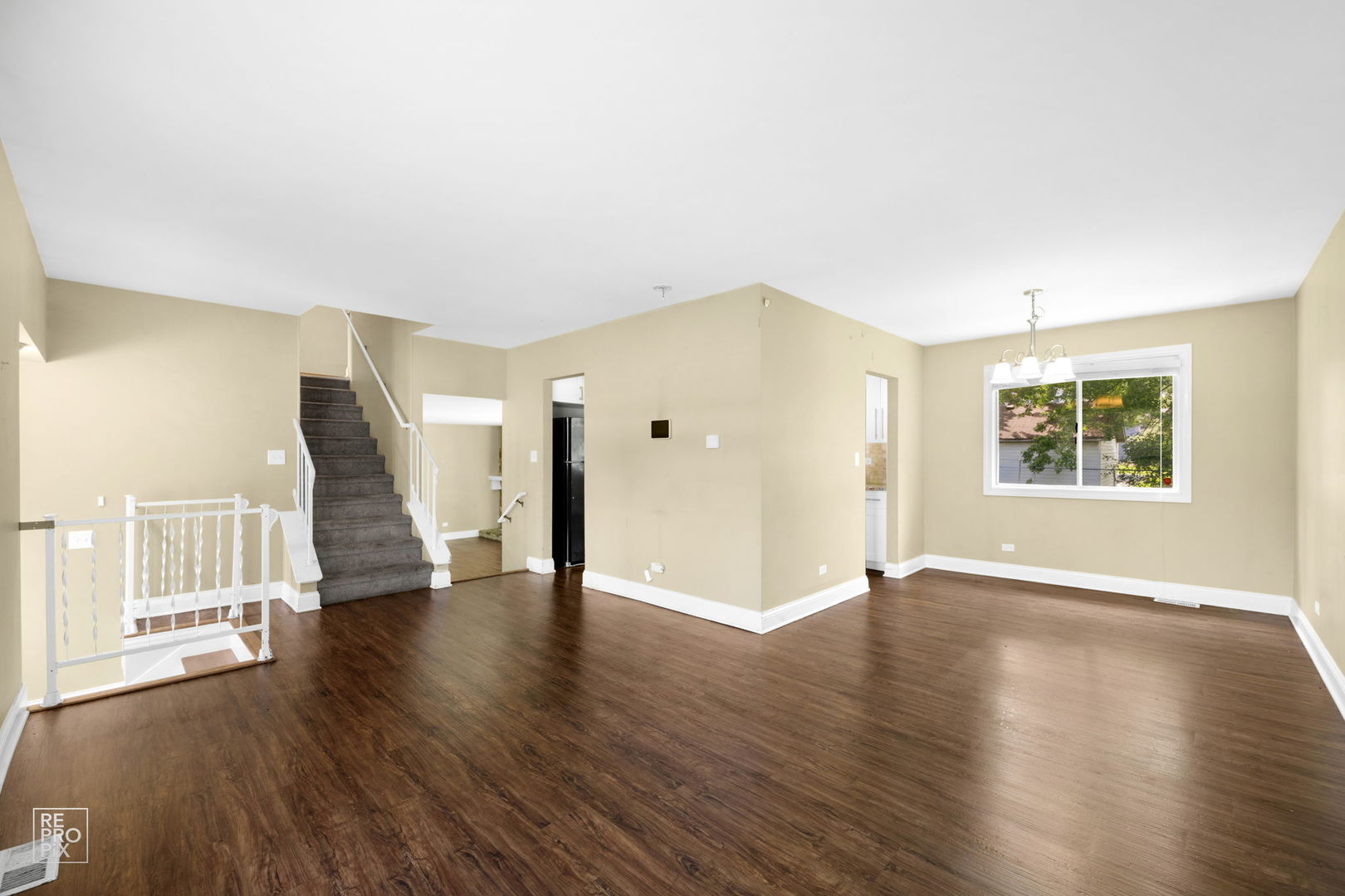 48 Pheasant Road Matteson, IL 60443 - Photo 8 of 23 an empty room with wooden floor and windows