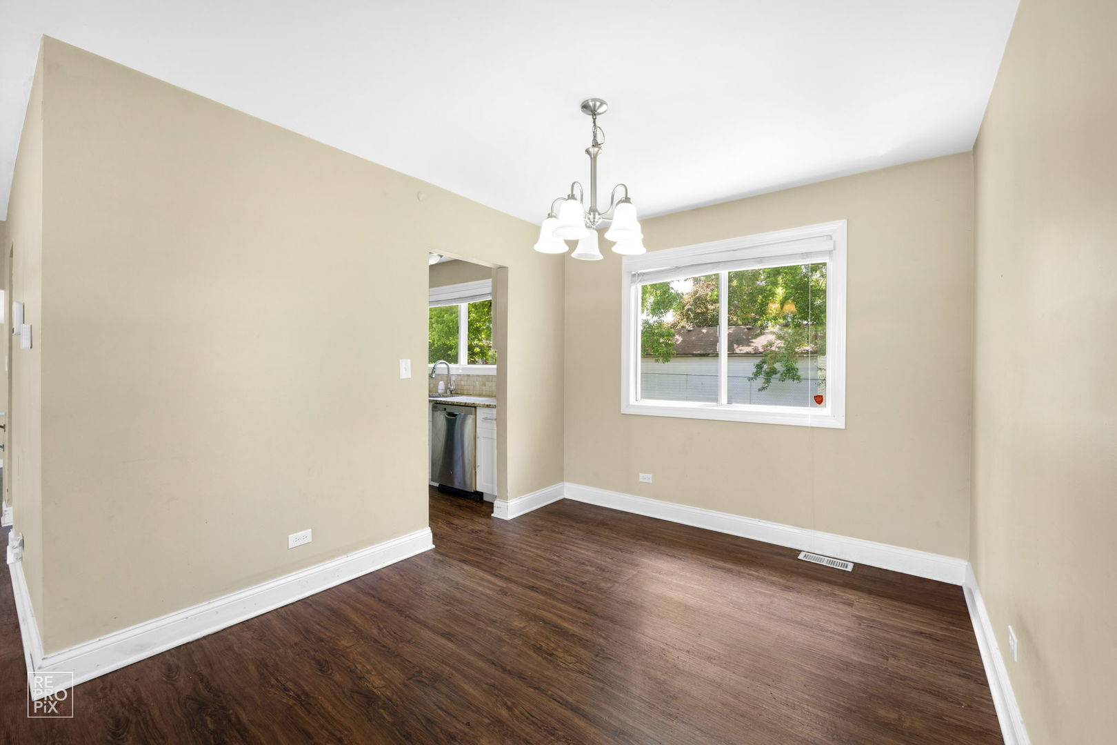 48 Pheasant Road Matteson, IL 60443 - Photo 9 of 23 a view of an empty room with wooden floor and a window
