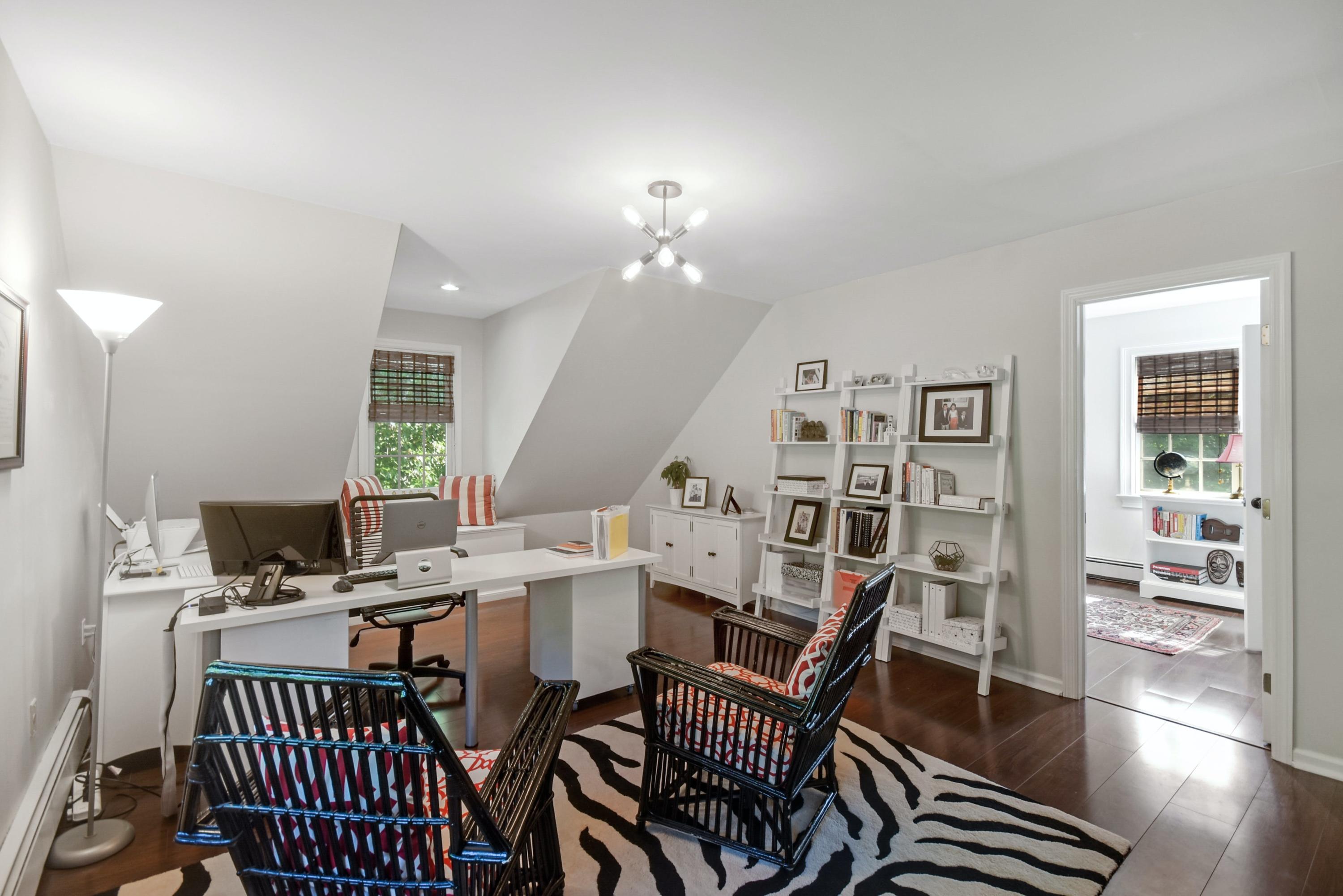 181 Brushy Ridge Road New Canaan, CT 06840 - Photo 13 of 34 a view of a workspace with furniture and wooden floor