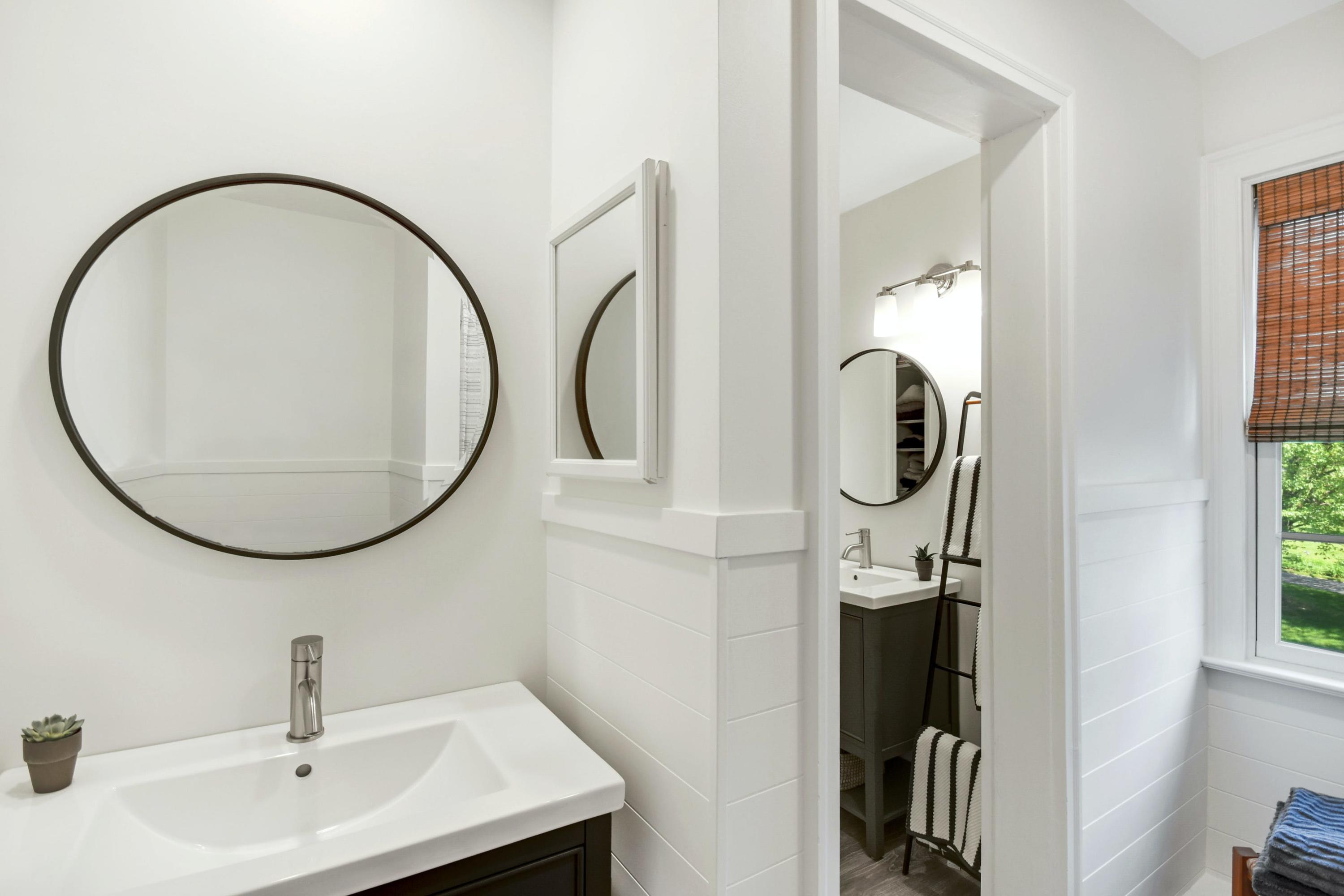 181 Brushy Ridge Road New Canaan, CT 06840 - Photo 16 of 34 a bathroom with a sink and a mirror
