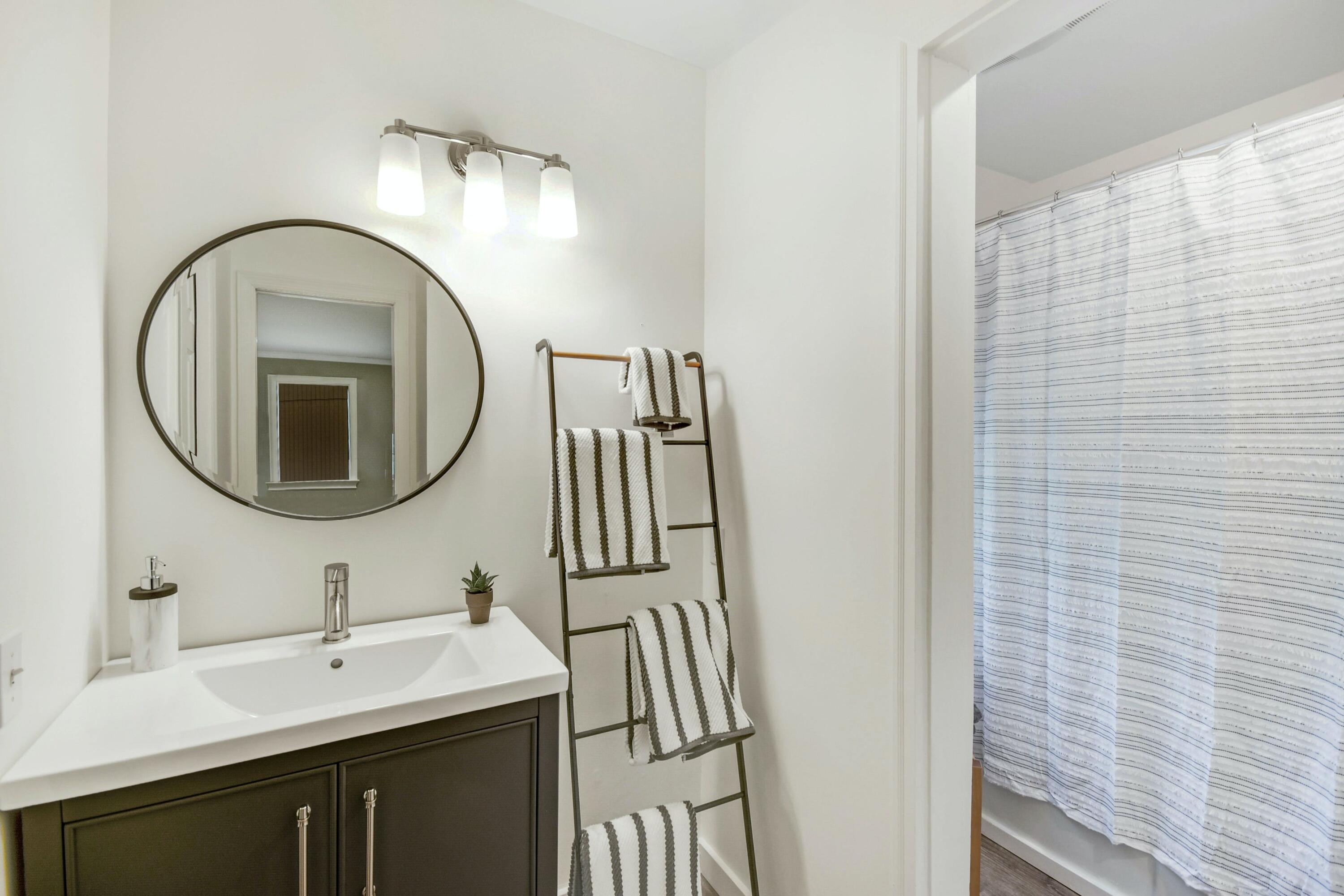181 Brushy Ridge Road New Canaan, CT 06840 - Photo 17 of 34 a bathroom with a sink a mirror and a shower