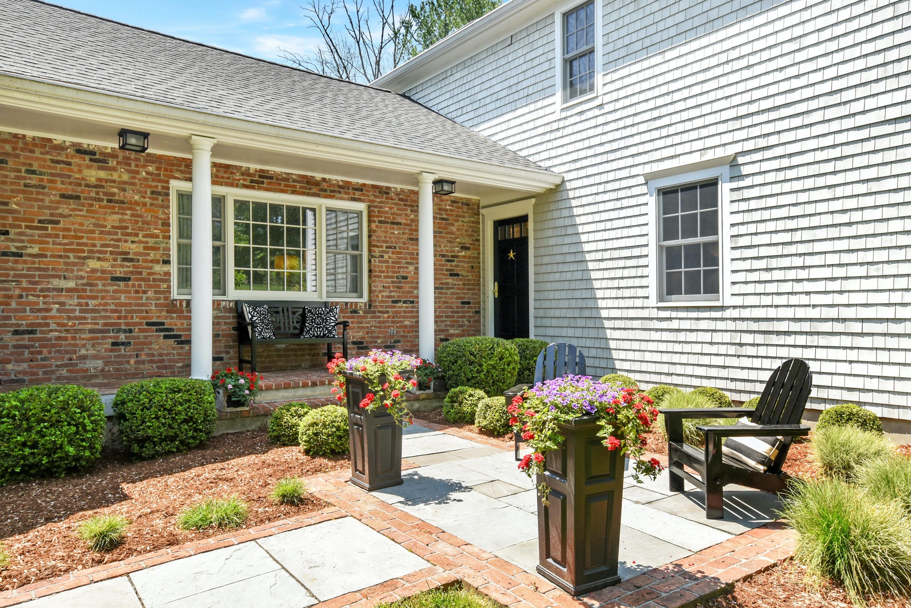 181 Brushy Ridge Road New Canaan, CT 06840 - Photo 3 of 34 a front view of a house with patio