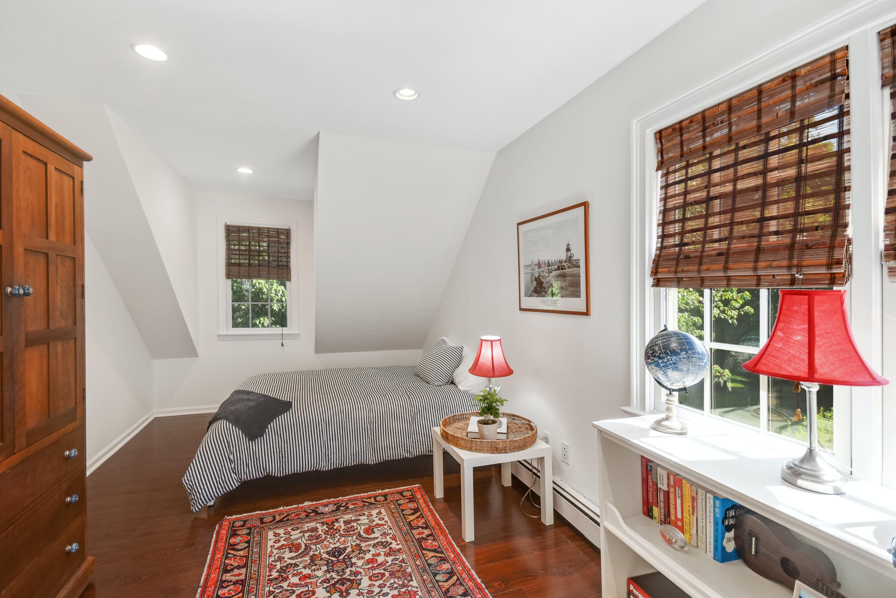181 Brushy Ridge Road New Canaan, CT 06840 - Photo 22 of 34 a bedroom with furniture and a window