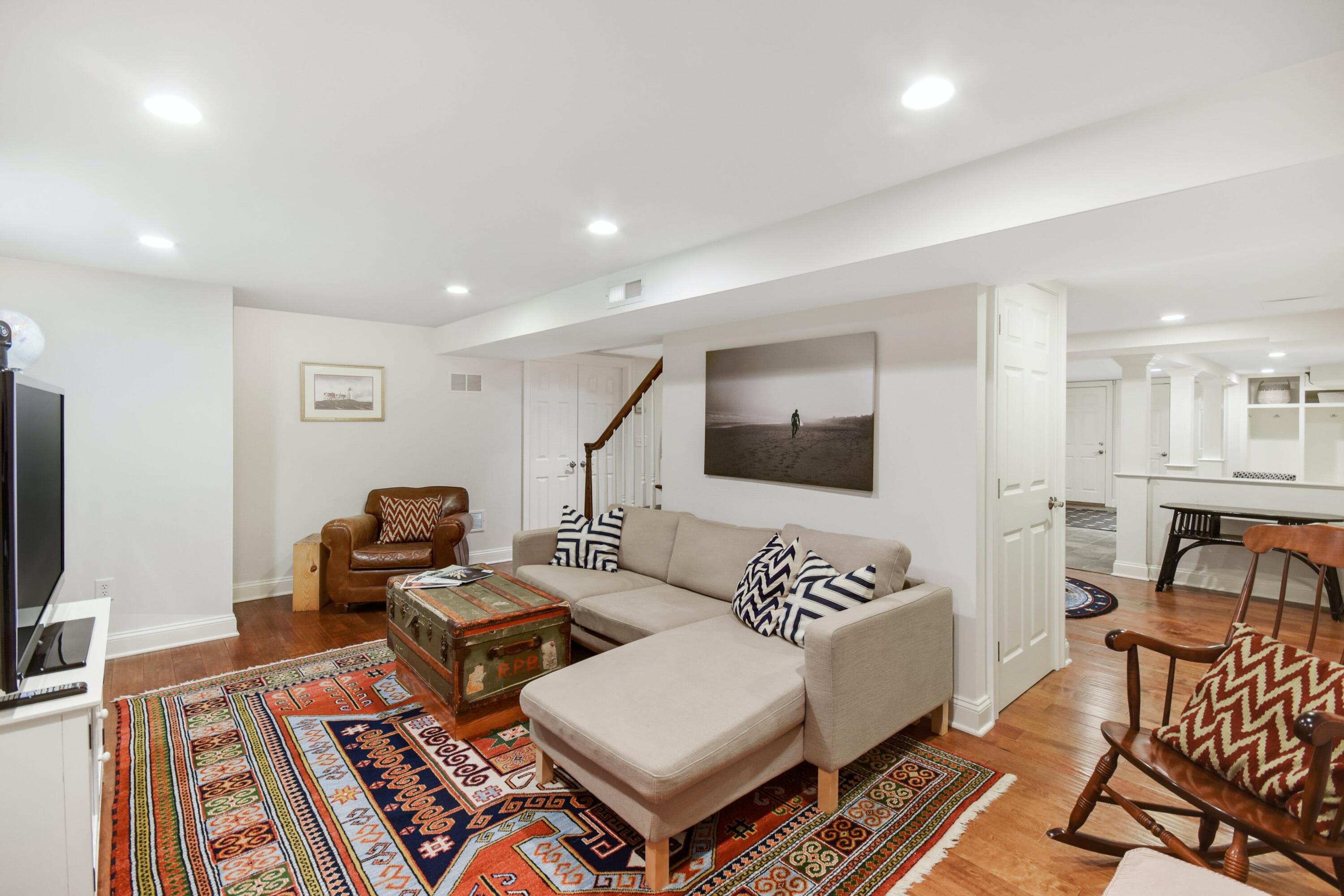 181 Brushy Ridge Road New Canaan, CT 06840 - Photo 25 of 34 a living room with furniture and a flat screen tv