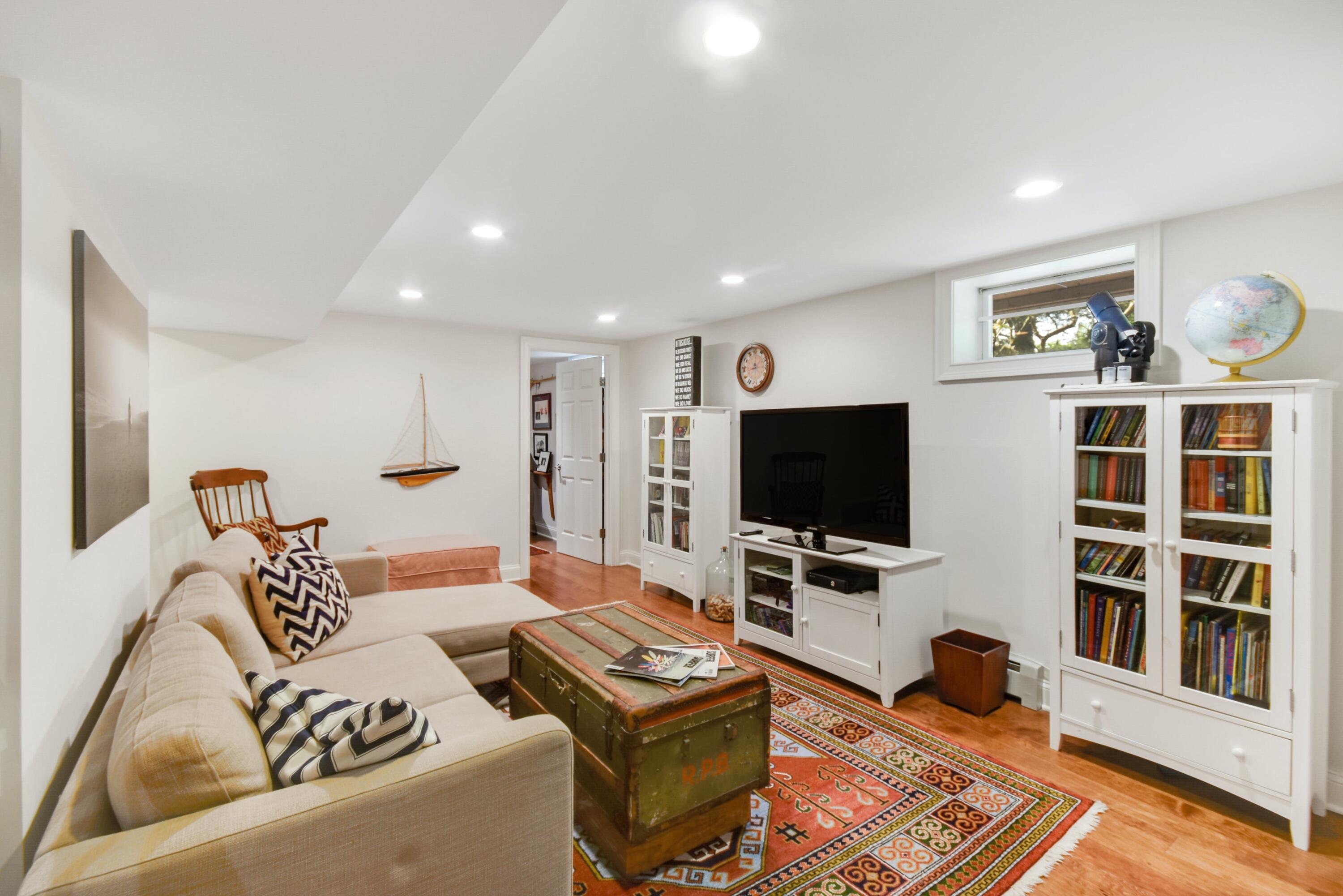181 Brushy Ridge Road New Canaan, CT 06840 - Photo 26 of 34 a living room with furniture and a flat screen tv