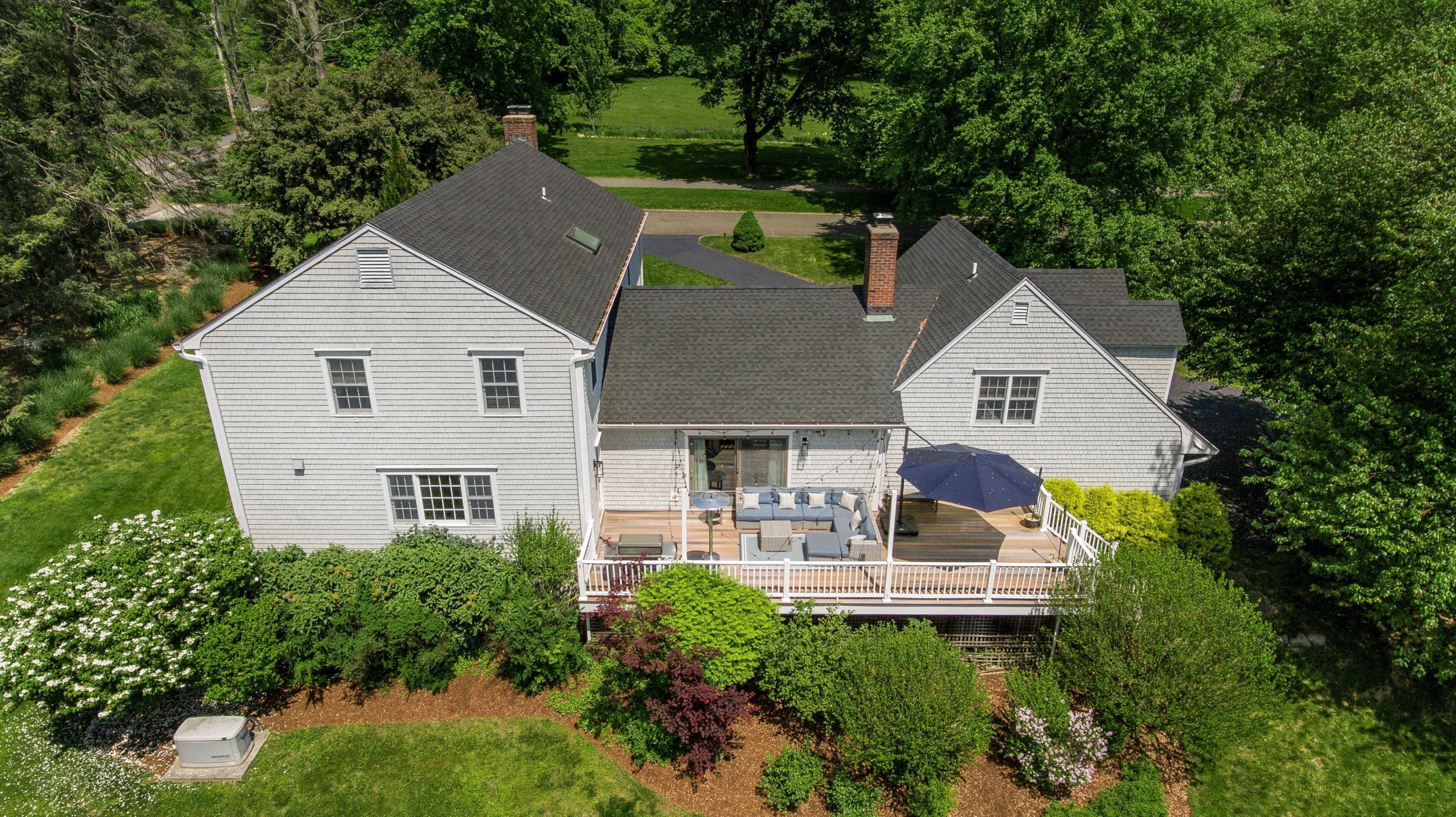 181 Brushy Ridge Road New Canaan, CT 06840 - Photo 31 of 34 a aerial view of a house with a yard and balcony