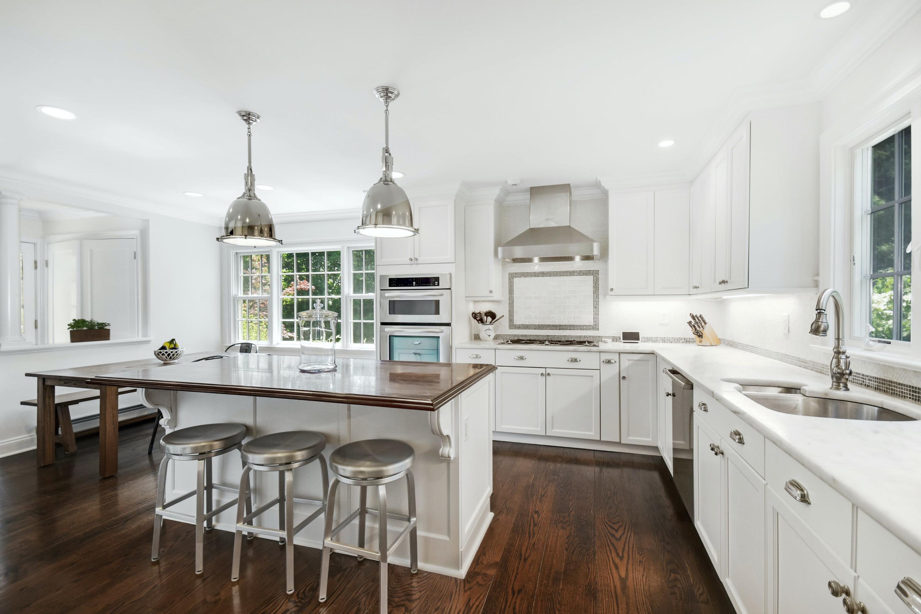 181 Brushy Ridge Road New Canaan, CT 06840 - Photo 7 of 34 a kitchen with appliances a sink and cabinets