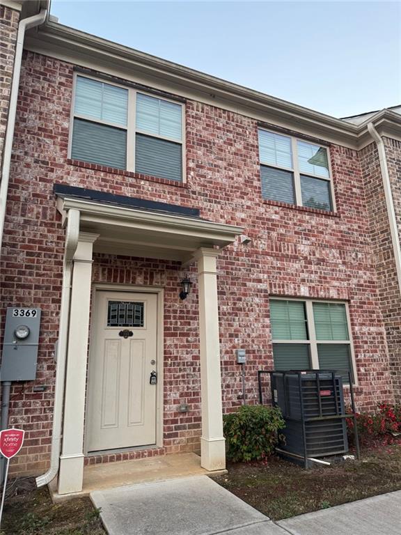 a front view of a building with potted plants