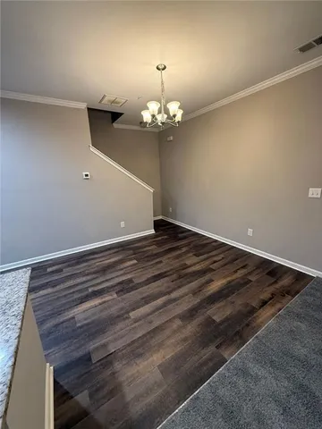 a view of a chandelier in an empty room