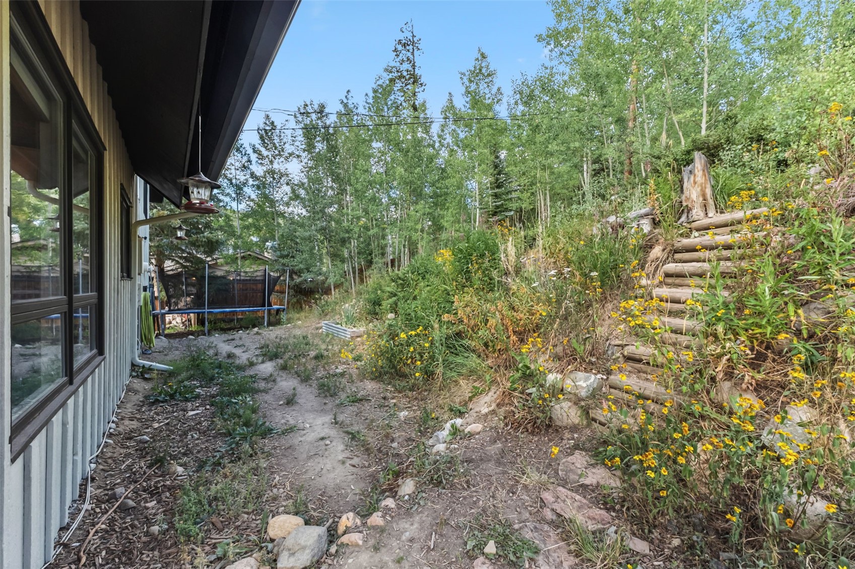 218 Deer Path Road Dillon, CO 80435 - Photo 37 of 49 The stairs go up to the top of the lot/yard and to the open space--soon you'll be on your way along the Tenderfoot Trail!