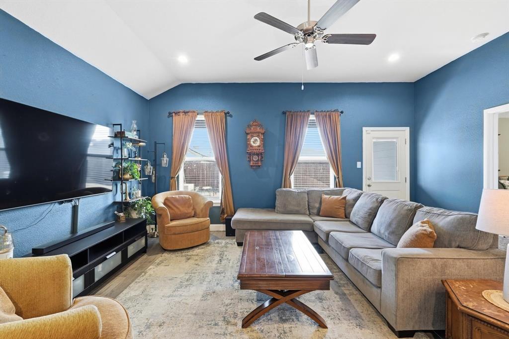 2213 Ruff Road Denton, TX 76205 - Photo 22 of 40 a living room with furniture and a flat screen tv
