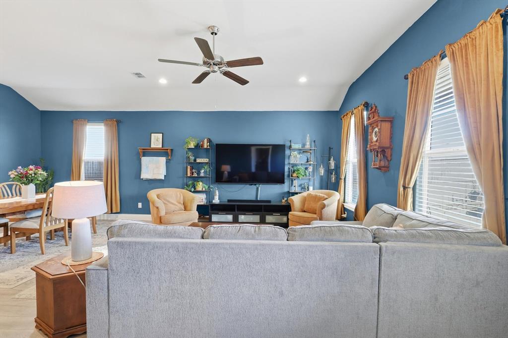 2213 Ruff Road Denton, TX 76205 - Photo 24 of 40 a living room with furniture and a flat screen tv