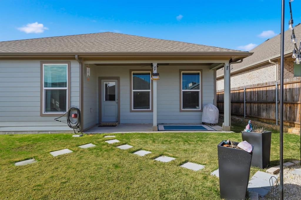 2213 Ruff Road Denton, TX 76205 - Photo 35 of 38 Large fenced in backyard with raised flowerbeds, and fire pit area for outdoor entertaining