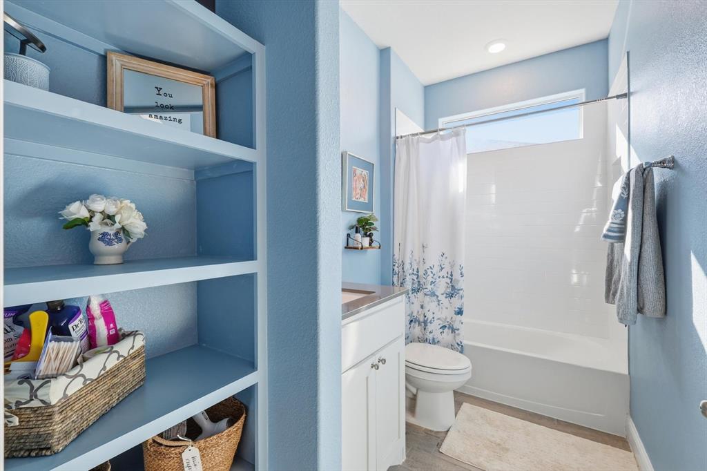 2213 Ruff Road Denton, TX 76205 - Photo 6 of 38 Guest bathroom with open shelving, custom mirror and granite