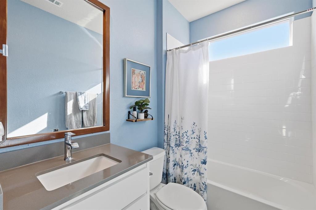 2213 Ruff Road Denton, TX 76205 - Photo 9 of 40 a bathroom with a sink toilet and shower