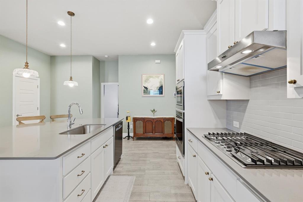2213 Ruff Road Denton, TX 76205 - Photo 10 of 38 Large kitchen with ample cabinetry, updated lighting and custom paint
