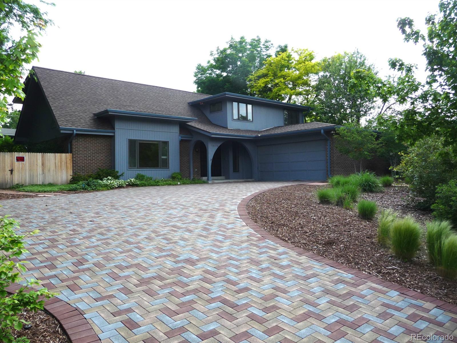 14130 Berry Road Golden, CO 80401 - Photo 1 of 28 a front view of a house with a garden