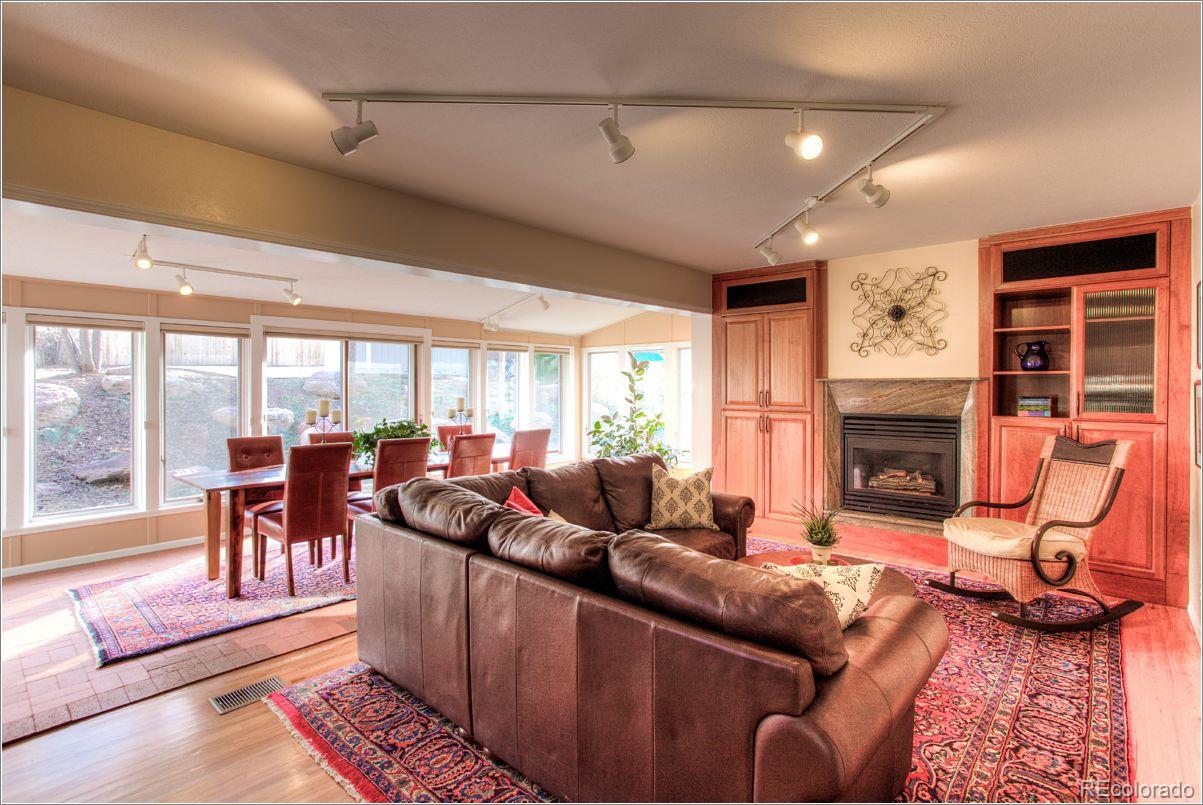 14130 Berry Road Golden, CO 80401 - Photo 11 of 28 a living room with furniture and a fireplace