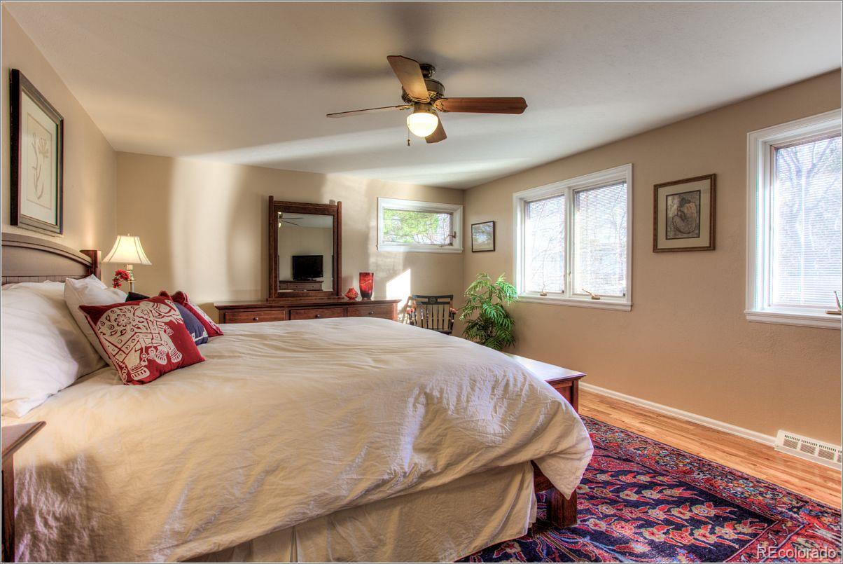 14130 Berry Road Golden, CO 80401 - Photo 17 of 28 a bedroom with a bed and window