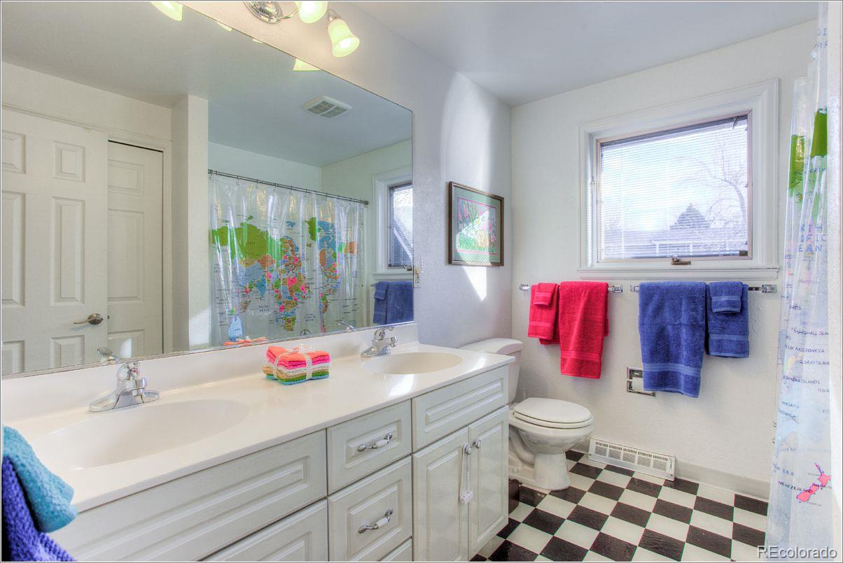14130 Berry Road Golden, CO 80401 - Photo 21 of 28 a bathroom with a sink and a mirror