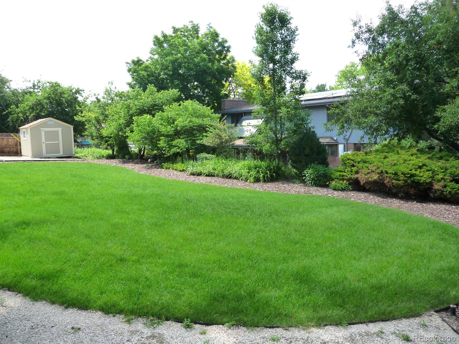 14130 Berry Road Golden, CO 80401 - Photo 27 of 28 a front view of a house with a yard