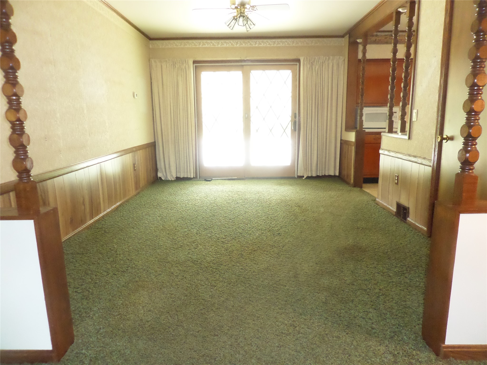 8920 Lake Pleasant Road Erie, PA 16509 - Photo 11 of 19 DINING ROOM HAS GLASS DOORS THAT LEAD TO A COVERED PATIO AND IN-GROUND POOL.