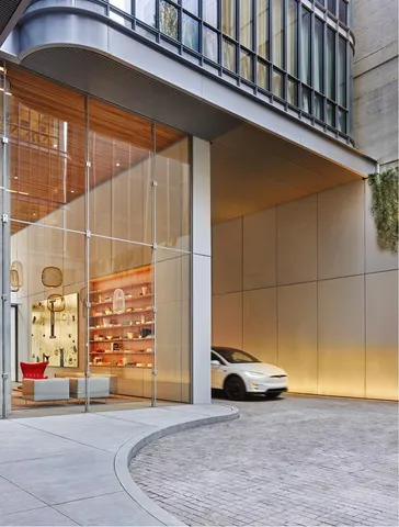 a view of a porch with a table and a potted plants