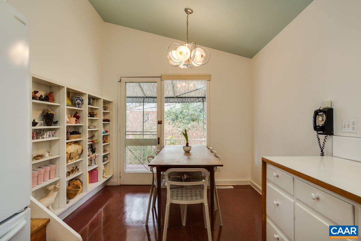 1521 Rugby Road Charlottesville, VA 22903 - Photo 18 of 27 a dining room with a window and chairs