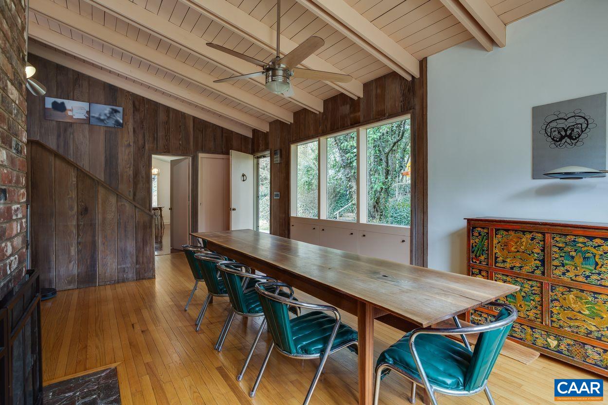 1521 Rugby Road Charlottesville, VA 22903 - Photo 8 of 27 a view of a dining room with furniture window and wooden floor