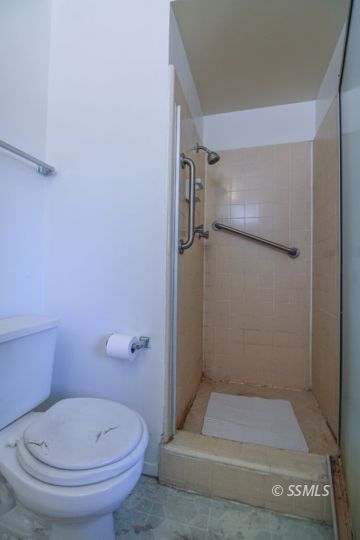 537 South Fairview Street Ridgecrest, CA 93555 - Photo 30 of 35 a bathroom with a toilet and a shower