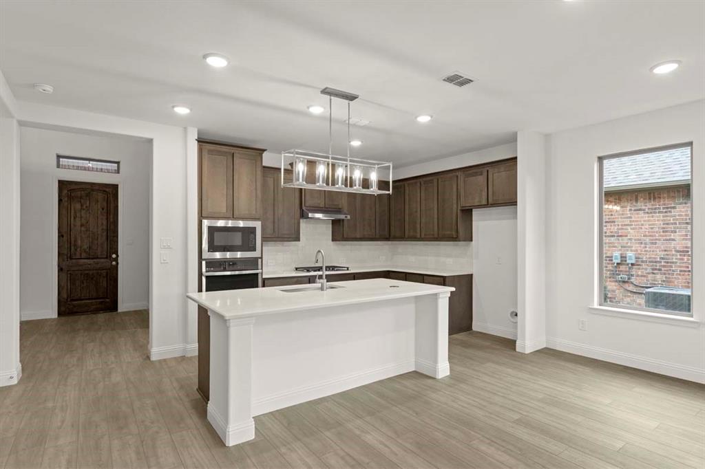 1443 Canadian Lane Van Alstyne, TX 75495 - Photo 2 of 24 02-1443-canadian-ln-van-alstyne-tx-kitchen-island-view