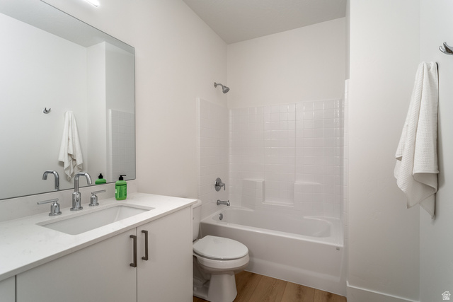2768 Becco Trail, Unit 63 St. George, UT 84770 - Photo 23 of 27 Full bathroom featuring vanity, light wood finished floors, and shower / tub combination