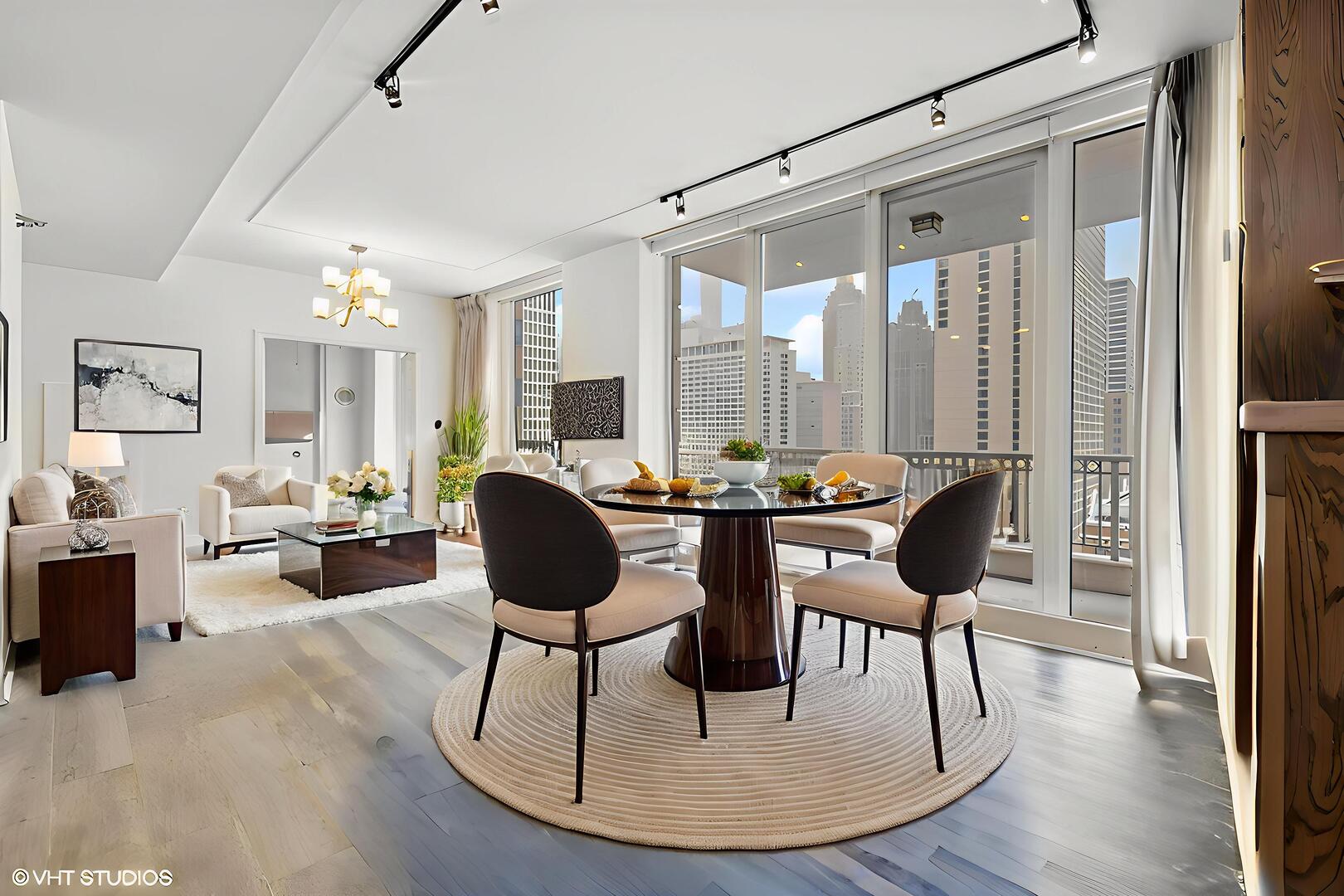 55 East Erie Street, Unit 1804 Chicago, IL 60611 - Photo 6 of 22 a living room with furniture a table and chairs