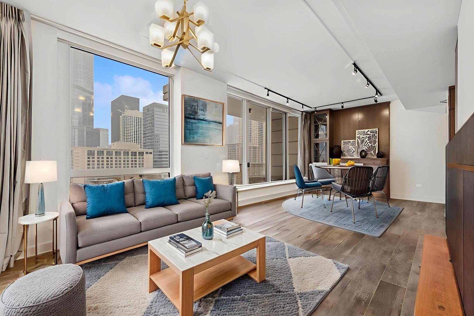 55 East Erie Street, Unit 1804 Chicago, IL 60611 - Photo 7 of 22 a living room with furniture and wooden floor