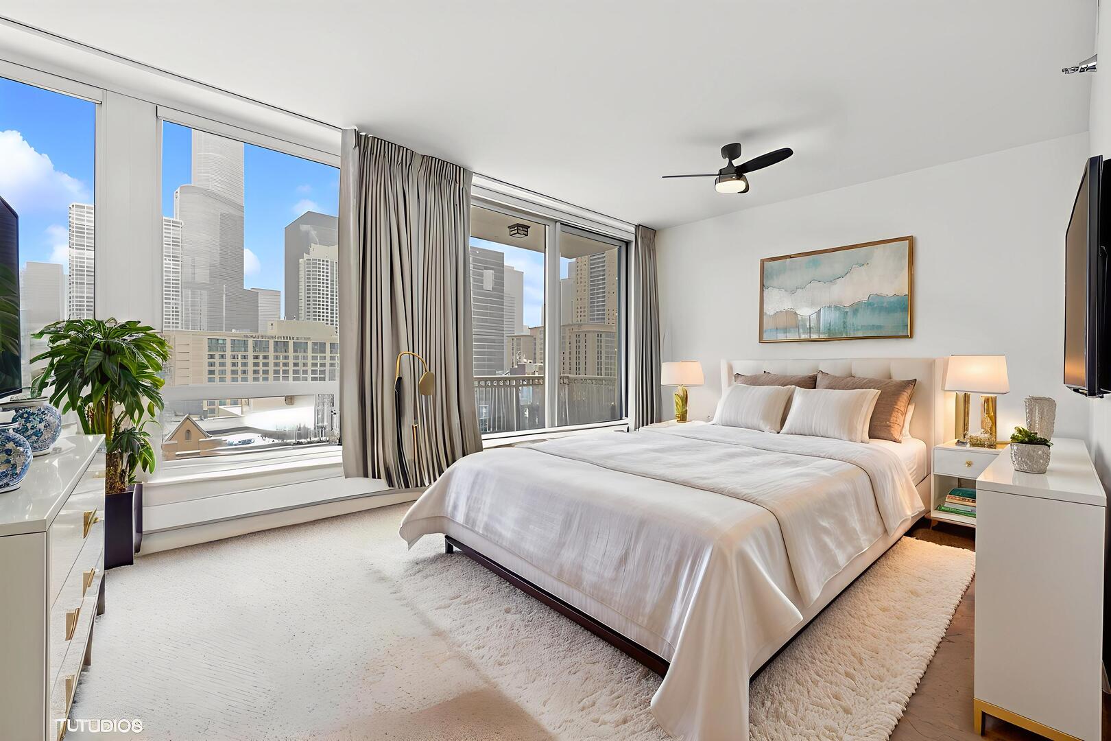 55 East Erie Street, Unit 1804 Chicago, IL 60611 - Photo 9 of 22 a bedroom with a large bed and a large window