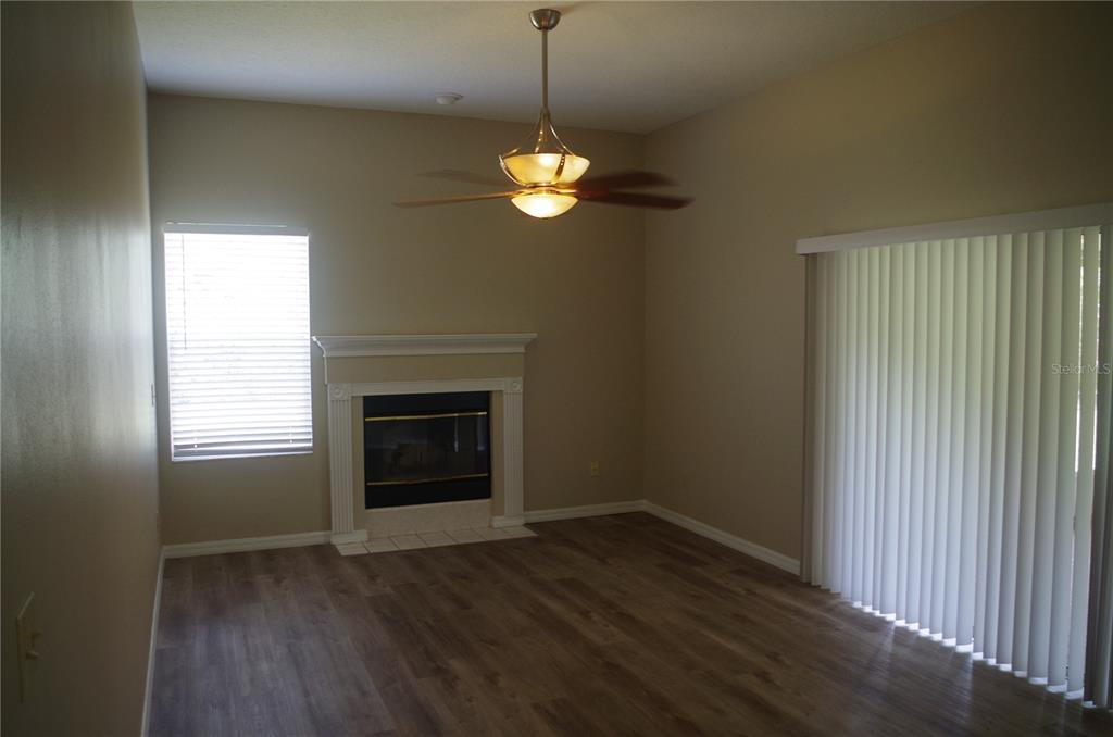 4207 Elba Place Valrico, FL 33596 - Photo 12 of 24 a view of a room window wooden floor and front door