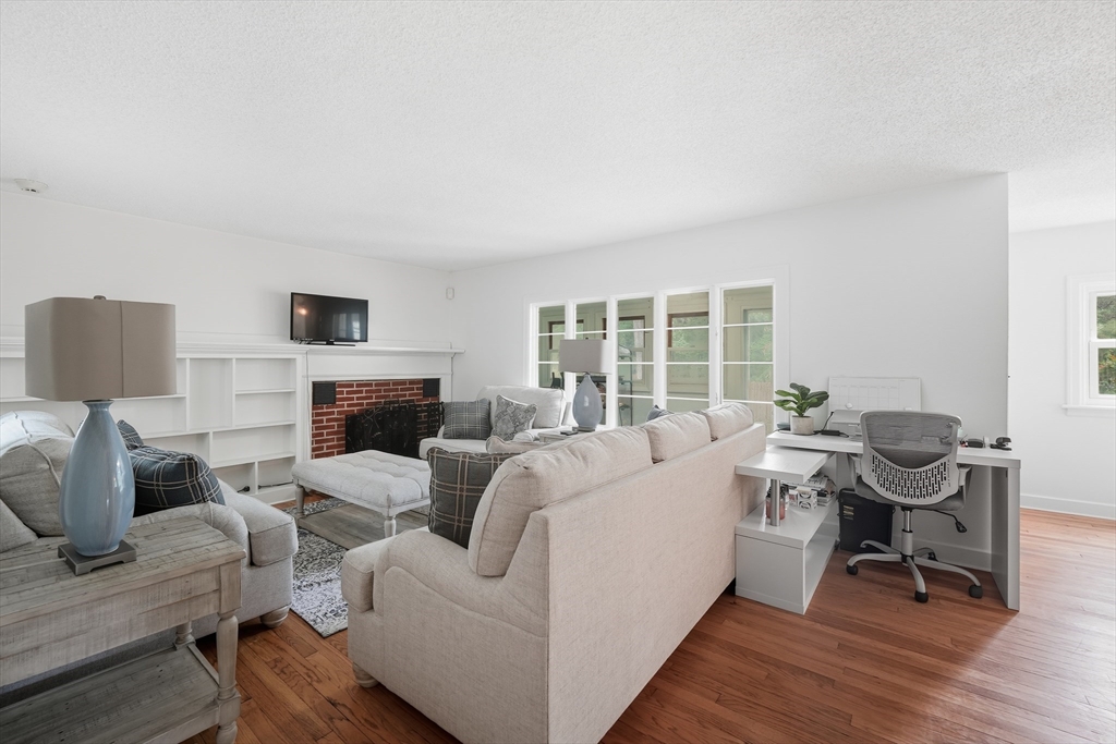 75 Carnavon Circle Springfield, MA 01109 - Photo 10 of 18 a living room with furniture fireplace and a table